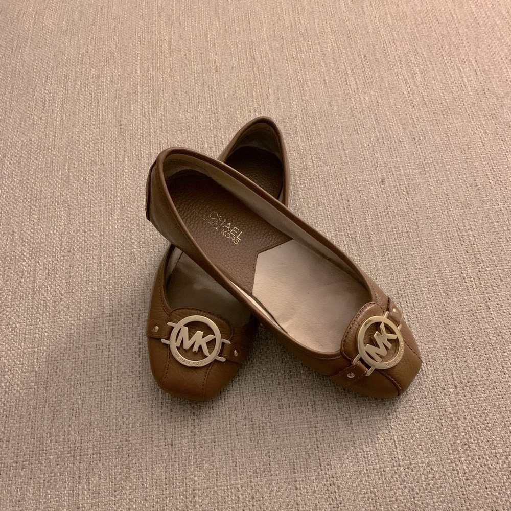 Michael Kors honey brown/tan flats with gold initials.
